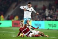 MIDDLESBROUGH, ENGLAND - JANUARY 21:  Patrick Bamford (L) tackles Manuel Lanzini of West Ham United (R) during the Premier League match between Middlesbrough and West Ham United at the Riverside Stadium on January 21, 2017 in Middlesbrough, England.  (Photo by Tony Marshall/Getty Images)